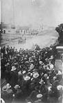 Royal North West Mounted Police (R.N.W.M.P.) holding back a crowd in Yorkton, Saskatchewan. 1907 1907.