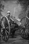 Lieutenant Arthur L. Howard behind an 1874-pattern Gatling gun ca 1875-1885.