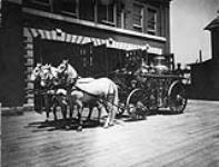 Fire reels in front of Laurier Avenue Station, Ottawa, Ontario. 1914 1914