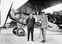 (War Trophy) Major W.A. Bishop and Lt. Col. W.G. Barker in front of a Fokker D. VII September, 1919.