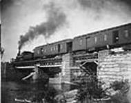 C.P.R. (Canadian Pacific Railway) Passenger Train crossing Mississippi River Bridge at Carleton Place, Ont ca. 1895 - 1900