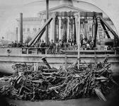 Québec Harbour Commission's Lifting Barge, showing a portion of the barge with the nest of anchors and chains raised during the months of June, July and August, 1877 1877.