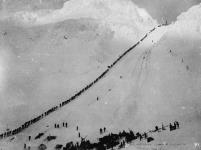 Packers ascending summit of Chilkoot Pass 1898 - 1899