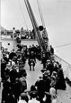 Immigrants playing leap frog on the SS "Empress of Britain". c 1910 1910