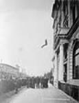 Vancouver firemen jumping into a life saving net 1910