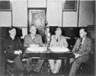 Rt. Hon. W.L. Mackenzie King and members of the Cabinet broadcasting messages to the Canadian people following the special emergency Cabinet meeting following Great Britain's declaration of war 3 Sept. 1939