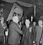 Rt. Hon. W.L. Mackenzie King congratulates Hon. Louis St. Laurent on his election as Leader of the Liberal Party at the National Liberal Convention 7 Aug. 1948