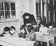 Canadian-trained teachers staff the internment camp school at Slocan City vers 1943