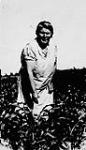 Mrs. Jack Broudy, Jewish farm wife in her garden, Edenbridge, Saskatchewan July, 1939