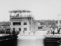 The Earl of Bessborough, Governor General of Canada, operating lower control E, Lock 6, during the official opening of the Welland Canal 6 Aug. 1932