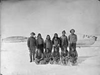 Group photo taken with Inuit [Scotty, the Chief, standing third from left] June 1904.