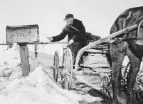 Rural routeman John Phillips of Osgoode, Ont., delivers farm mail from the Vernon, Ont., Post Office. April, 1947 April, 1947