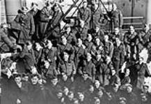 Canadian soldiers aboard an unidentified troopship arriving in Britain, ca. 1940 [c.a. 1940]