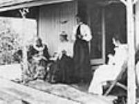Mrs. Catherine Parr Traill, her daughter, Miss Traill and 2 graddaughters on the verandah of her summer cottage on Minne-wa-wa, Stony Lake, this photo was taken a few days before her death 1899
