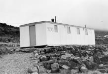 Exterior view of the Eskimo Co-operative sewing centre in Cape Dorset, N.W.T July 1961.