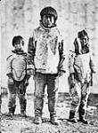 Unidentified Inuit man, boy and girl 1872-1873.