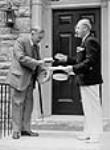 A.J. Haines, M.P.P., presenting Rt. Hon. W.L. Mackenzie King with the key to William Lyon Mackenzie's home 18 June 1938