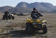 [Prime Minister Stephen Harper rides an ATV in York Sound, Nunavut as part of Operation NANOOK] 26 August 2014