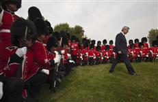 [Prime Minister Stephen Harper leaves his spot after having a group photo taken with the honour guard at Fort Lennox in Saint-Paul-de-l'Île-aux-Noix, Quebec] 14 September 2012