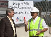 [Prime Minister Stephen Harper chats with senior project manager Chris Hawkins at the construction site of the Queenston Plaza border crossing in Niagara-on-the-Lake, Ontario] 3 September 2009
