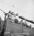 Perry sisters, female munitions workers at the Dominion Arsenals Ltd. plant, enjoy a tour ride around Québec City 24 août 1942