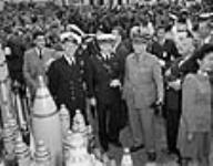 Guests of honour at the celebration marking the delivery of the 100,000,000th heavy projectile manufactured in Canada at the ammunition filling plant of Defence Industries Limited, Cherrier, Quebec Sept. 1944