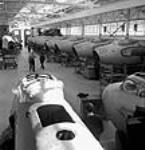 View of De Havilland mosquito airplanes being assembled in a hangar Sept. 1944