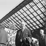 Prime Minister of Canada Lester B. Pearson in front of the Katimavik at Expo 67 1967