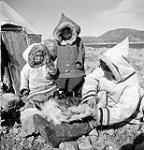 Three unidentified Inuit July 1951.