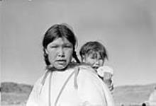 [Sanni Pootoogook and her daughter, Pia Pootoogook. This woman has also been identified as Ulaaju, the wife of Pinnguaqtuq, and her daughter Mary.] October 1951