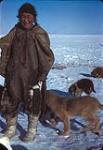 Picture of a woman with dogs [Gamma Qilleqtii Mary Ford], Eskimo Point, N.W.T., [Arviat, Nunavut], 1936 1936.