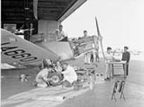 Groundcrew servicing a Fairchild Cornell I aircraft of No. 19 Elementary Flying Training School, RCAF October 1944.