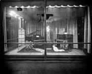 Display window containing Heintzman pianos ca. 1920s