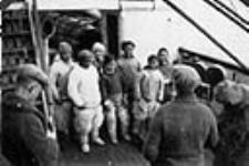 Inuit from Etah [Klissho, Panik-pa, Palungwah, Innacushia, Sadlo, Angotikoosha, Atoosoongwah], who spent the winter of 1923-1924 at Craig Harbour, aboard C.G.S. Arctic August 1924