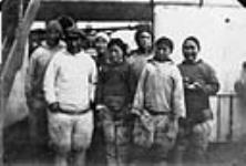 Inuit from Etah [Kisshoo, Panik-pa, Palungwah, Innacushia, Sadlo, Angotikoosha, Atoosoongwah], who spent the winter of 1923-1924 at Craig Harbour, aboard C.G.S. Arctic August 1924