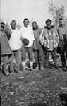 Group of Inuit men with a non-Inuit man (right) 1922