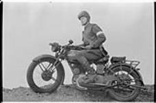 Soldier on a Harley Davidson motorcycle