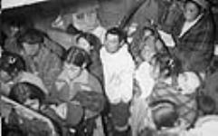 Inuit men, women and children aboard R.M.S. Nascopie ca. 1945