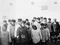 Inuit men and children aboard R.M.S. Nascopie ca. 1945-1946