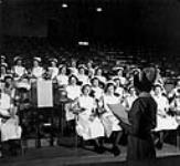 Lecturing to student nurses in the large theatre, The Hospital for Sick Children, Toronto, Ont 1953