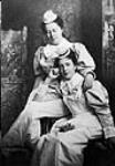 Two nurses from the John H. Stratford Hospital Training School for Nurses (later re-named the Brantford General Hospital School for Nurses) in their student nurse uniforms. One of them is wearing the new uniform introduced in 1895 1897