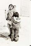 Inuk mother with her two children [graphic material] 1936
