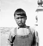 An unidentified Inuit boy wearing overalls [Casimir Kriterdluk]  [graphic material] 1951 ?.