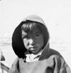 An unidentified Inuit boy wearing a hooded sweater [graphic material] 1951 ?
