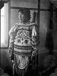 Unidentified Inuit woman wearing a beaded artigi 1929.