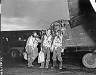 Aircrew with a Handley Page Halifax B.III aircraft of No. 433 (Porcupine) Squadron, R.C.A.F. [graphic material] : returning from a daylight raid on German flying-bomb sites in France. Skipton-on-Swale, England, 1944 1944