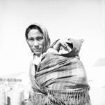Inuk woman "Putugoyak" (Marion) carrying a baby in her shawl Summer 1963