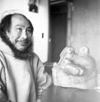 Inuk artist "Aopilarojuk" (Mariano), the best known carver from Repulse Bay, with his soapstone carving 1967