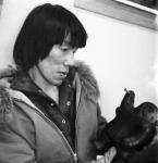 Inuk artist "Akeeah" (Mathew) holding one of his carvings 1969