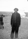 Inuk man and boy standing outside a summer tent 1944